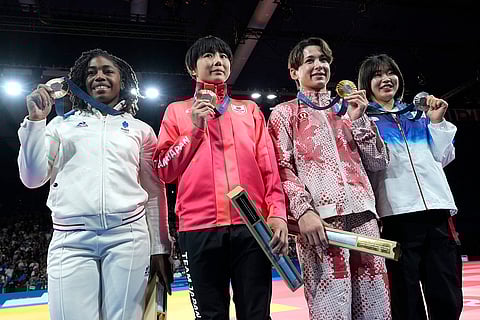 Medal ceremony for women's -57kg event in team judo competition